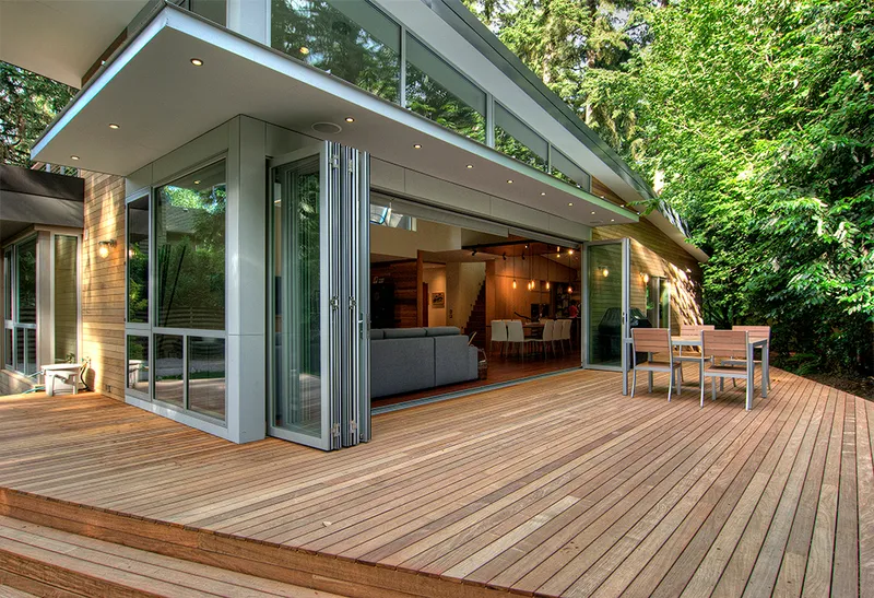 LaCantina door installation on a house in the woods