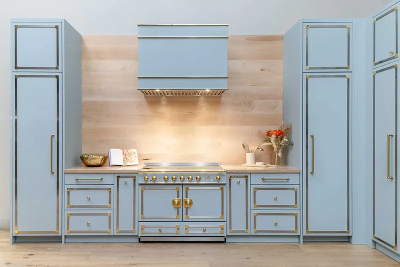 John Michael Studio cabinetry with a lacornue range
